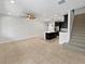 Open-concept kitchen and living room with tile flooring and modern appliances at 1998 Milkweed Trce, Lutz, FL 33558