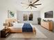 Bright main bedroom featuring a modern bed, stylish decor, and ample natural light at 1998 Milkweed Trce, Lutz, FL 33558