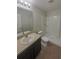 Stylish bathroom with a vanity and tub with shower at 27118 Fernery Ave, Brooksville, FL 34602