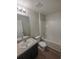 Clean bathroom with granite-look vanity top and tub-shower combo at 27118 Fernery Ave, Brooksville, FL 34602
