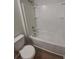 Well-maintained bathroom with a clean and modern bathtub, toilet and modern shower head at 27118 Fernery Ave, Brooksville, FL 34602