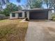 Charming single-story home with a well-maintained lawn at 27118 Fernery Ave, Brooksville, FL 34602