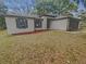 Charming single-story home with a well-maintained lawn at 27118 Fernery Ave, Brooksville, FL 34602