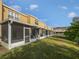 Exterior view of screened-in porches with green lawn and blue sky at 6122 Osprey Lake Cir, Riverview, FL 33578
