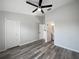 Spacious bedroom with ensuite bathroom, laminate floors, ceiling fan and two closets at 6122 Osprey Lake Cir, Riverview, FL 33578