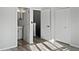 Bright bedroom with two closets, laminate floors, and an ensuite bathroom with a vanity sink at 6122 Osprey Lake Cir, Riverview, FL 33578