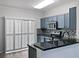 Updated kitchen features shaker cabinets, stainless appliances, and a tile backsplash at 6122 Osprey Lake Cir, Riverview, FL 33578