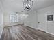 Spacious living room with sleek flooring and natural light. Neutral tones throughout at 6122 Osprey Lake Cir, Riverview, FL 33578