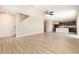 Open concept living space with modern flooring flowing into the adjacent kitchen at 11807 Myrtle Rock Dr, Riverview, FL 33578
