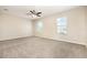 Spacious main bedroom with carpeted floor, two windows, and neutral wall color at 11807 Myrtle Rock Dr, Riverview, FL 33578