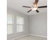 Bright bedroom featuring a ceiling fan, neutral paint, and tiled flooring at 13581 Willow Bluestar Loop, Riverview, FL 33579