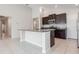 Bright kitchen features an island, granite countertops, and stainless steel appliances at 13581 Willow Bluestar Loop, Riverview, FL 33579
