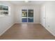 Sunny bedroom with sliding glass doors leading to the pool and backyard area at 1404 Rosewood Ave, Dunedin, FL 34698