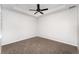 Cozy bedroom with neutral carpet, a ceiling fan, and ample natural light at 5710 Colony Glen Rd, Lithia, FL 33547