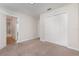 Bright bedroom featuring neutral walls and carpet, and a large closet, ideal for comfortable living at 13417 Lake Monroe Pl, Riverview, FL 33579
