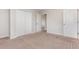 Neutral bedroom featuring ample closet space, neutral walls, and carpet, offering both storage and comfort at 13417 Lake Monroe Pl, Riverview, FL 33579