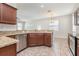 Well-lit kitchen showcasing granite counters, stainless steel appliances, and open layout at 13417 Lake Monroe Pl, Riverview, FL 33579