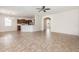 Spacious living area with tile floors, neutral paint, archways and natural light at 13417 Lake Monroe Pl, Riverview, FL 33579