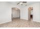 Bright living area with archways, neutral color palette, and tile flooring throughout at 13417 Lake Monroe Pl, Riverview, FL 33579