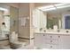 Large bathroom has double vanity, bathtub, and a skylight that brings in natural light at 26187 Argentina Dr, Punta Gorda, FL 33983