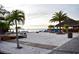Charming beach bar area with palm trees, beach seating, and a relaxed atmosphere at 26187 Argentina Dr, Punta Gorda, FL 33983