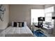 Well-lit bedroom features a single bed with work space by the window at 26187 Argentina Dr, Punta Gorda, FL 33983