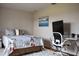 Bedroom features decorative bed spread and an adjustable desk with a monitor at 26187 Argentina Dr, Punta Gorda, FL 33983