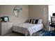Well-lit bedroom features a single bed with work space at 26187 Argentina Dr, Punta Gorda, FL 33983