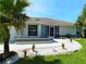 Lovely single-story home boasting beautiful landscaping and a welcoming entrance at 26187 Argentina Dr, Punta Gorda, FL 33983
