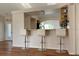 Kitchen bar seating with open view to additional kitchen area at 26187 Argentina Dr, Punta Gorda, FL 33983