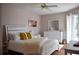 Cozy bedroom featuring a soft bed, dresser, and ample natural light at 26187 Argentina Dr, Punta Gorda, FL 33983