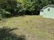 A lush backyard is ready for new owners of this charming home to add their personal touch at 3615 E Grove St, Tampa, FL 33610