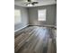 Comfortable bedroom featuring new floors, fresh paint, and ample natural light at 3615 E Grove St, Tampa, FL 33610