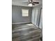 Comfortable bedroom with new floors, fresh paint, closet, and natural light at 3615 E Grove St, Tampa, FL 33610