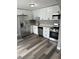Bright kitchen with stainless steel appliances and modern cabinetry with new floor at 3615 E Grove St, Tampa, FL 33610