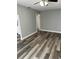 Cozy living room featuring new floors, fresh paint, and ample natural light at 3615 E Grove St, Tampa, FL 33610