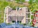 Top-down aerial view of a condo, showing roof, surrounding greenery, and parking at 10520 Windsor Lake Ct # 10520, Tampa, FL 33626