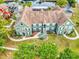 Birds eye view of the property with lush landscaping, mature trees, and sidewalks at 10520 Windsor Lake Ct # 10520, Tampa, FL 33626