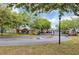 Elegant entrance to Lake Chase with brick pillars, landscaping, and a secure gated entry at 10520 Windsor Lake Ct # 10520, Tampa, FL 33626