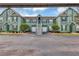 Inviting condominium with pleasing curb appeal, tidy landscaping, and attached garage at 10520 Windsor Lake Ct # 10520, Tampa, FL 33626