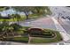 Well landscaped brick signage at the entrance to Tampa Palms surrounded by greenery and flowers at 5701 Ainsworth W Ct, Tampa, FL 33647