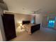 Large bedroom with neutral walls, ceiling fan, closet, and glass patio doors to let the sunshine in at 5701 Ainsworth W Ct, Tampa, FL 33647