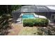 Secluded screened in pool area surrounded by greenery; a private oasis for relaxation and entertainment at 5701 Ainsworth W Ct, Tampa, FL 33647