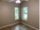 Bedroom features neutral walls, tile floors, and matching windows for natural light at 1210 Etchfield Cir, Brandon, FL 33511