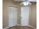 Bedroom with bi-fold closet and standard entry door at 1210 Etchfield Cir, Brandon, FL 33511