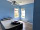 Bright bedroom with tiled floor, windows, and a ceiling fan at 1210 Etchfield Cir, Brandon, FL 33511