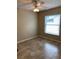 Neutral bedroom with a ceiling fan, tile floor, and a large window offering bright light at 1210 Etchfield Cir, Brandon, FL 33511