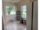 Bright breakfast nook features large windows and tile flooring with a view of the outdoors at 1210 Etchfield Cir, Brandon, FL 33511
