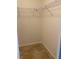 Empty walk-in closet with wire shelving and tiled flooring at 1210 Etchfield Cir, Brandon, FL 33511