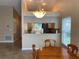 Dining room with a view to kitchen featuring tile flooring and neutral paint at 1210 Etchfield Cir, Brandon, FL 33511